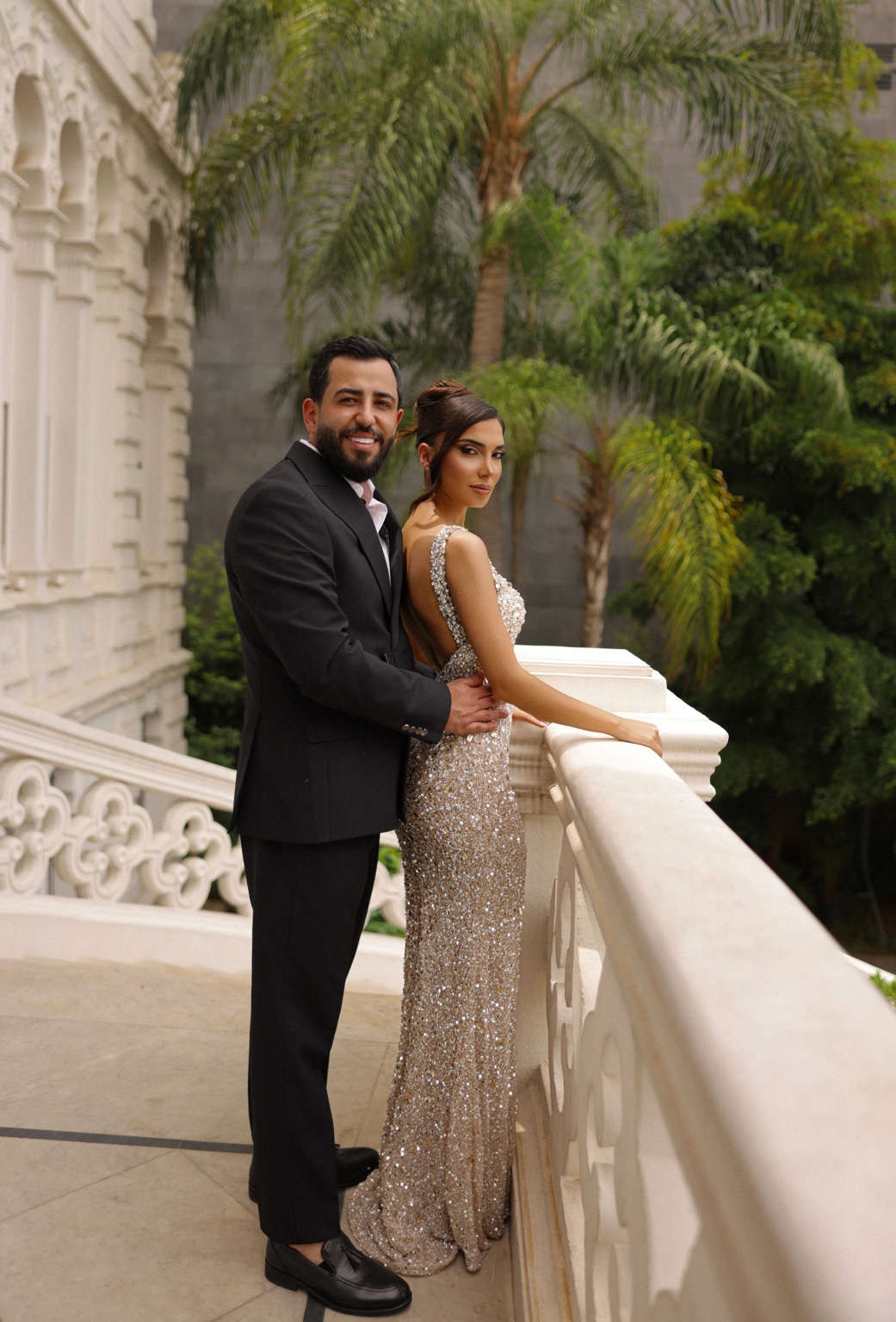 Bride and groom by the balcony